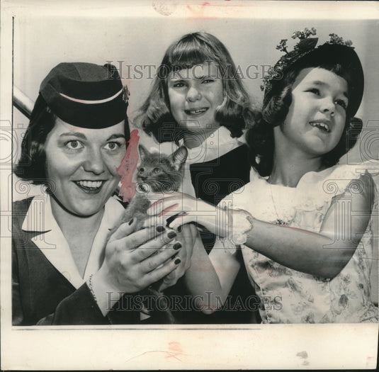 1957, Julie & Patricia Nixon give kitten to a stewardess, Washington - Historic Images