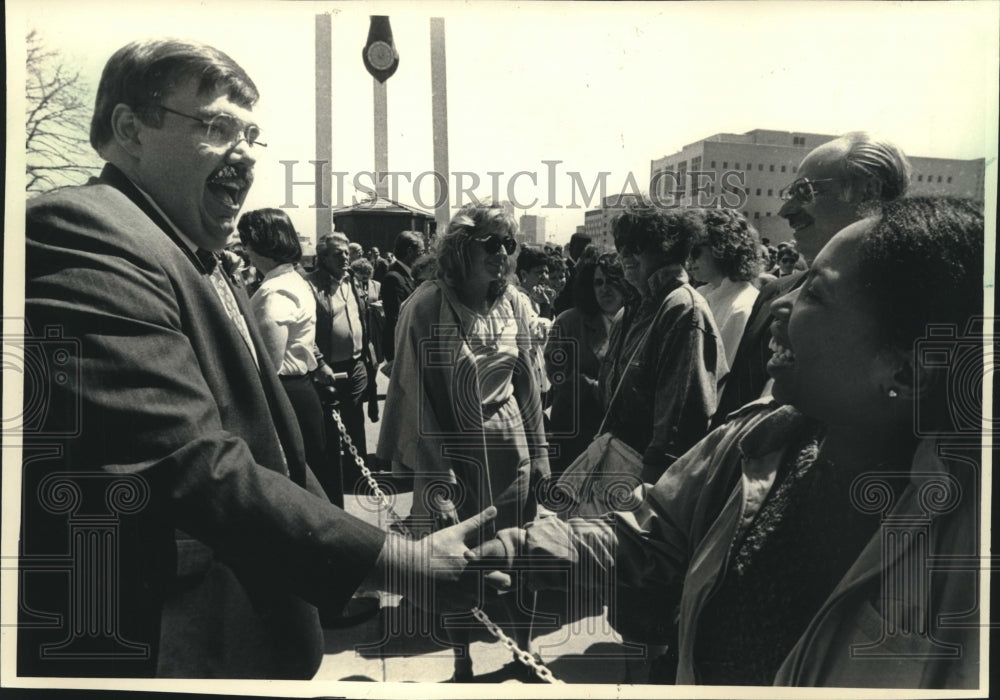 1988, David F. Schulz shaking hands after his inauguration, Wisconsin - Historic Images