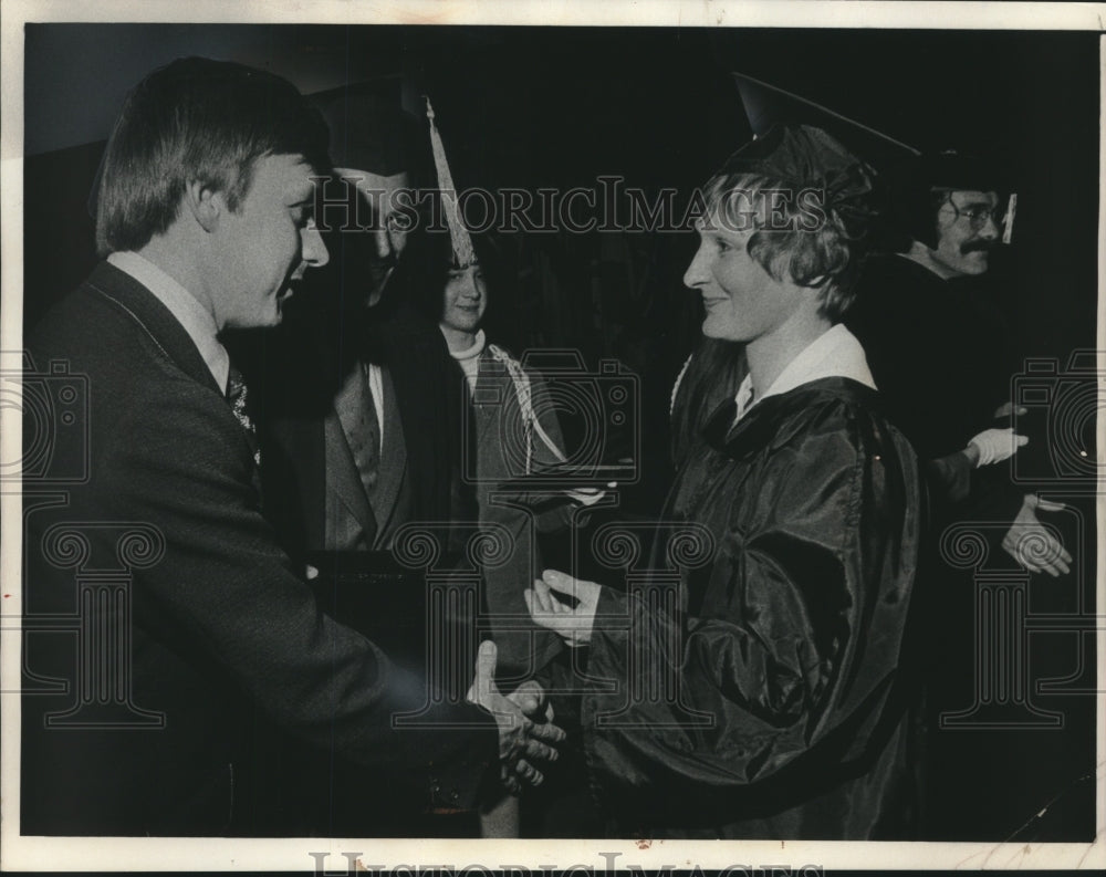 1974, Lt. Governor Martin Schreiber gives wife Elaine her degree - Historic Images