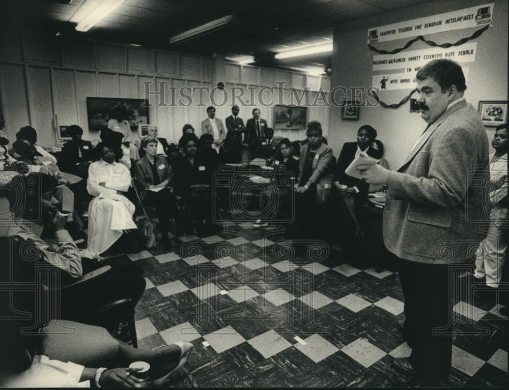 1989 County Executive David F. Schulz talks to business owners - Historic Images