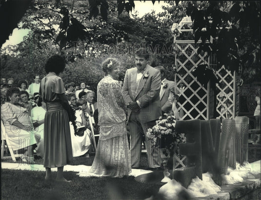 1987 Dave Schulz and JoAnn Dowe at wedding in Gardens, Milwaukee. - Historic Images