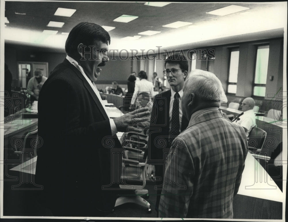 1988, David Schulz, Marc Duff, Orville Martin speaking, Waukesha. - Historic Images