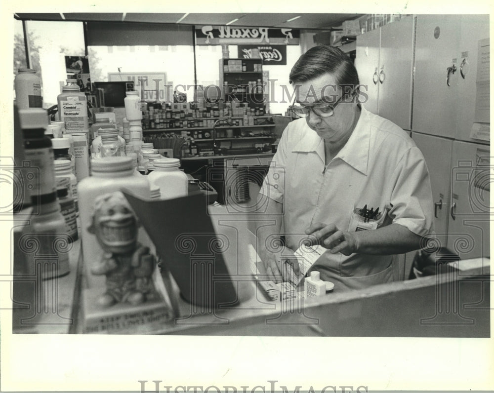 1982, Jerry Jaworowicz Fills Prescription At Pharmacy in Wisconsin - Historic Images