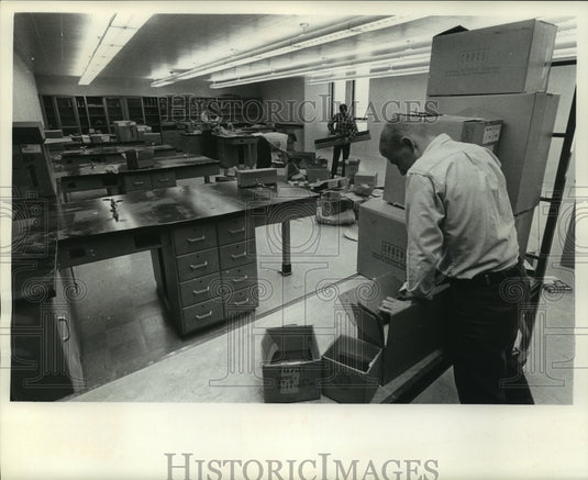 1965, Youth corp workers help teacher Emil Ottto unpack, Milwaukee - Historic Images
