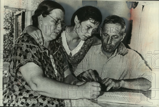 1981, Soviet spaceman, Gherman Titov, family members writing letter - Historic Images