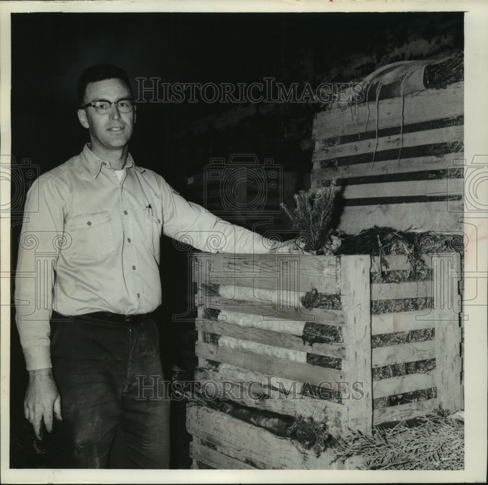 1965 Press Photo Harold E. Berndt, nursery manager, checking trees - mjc21735 - Historic Images