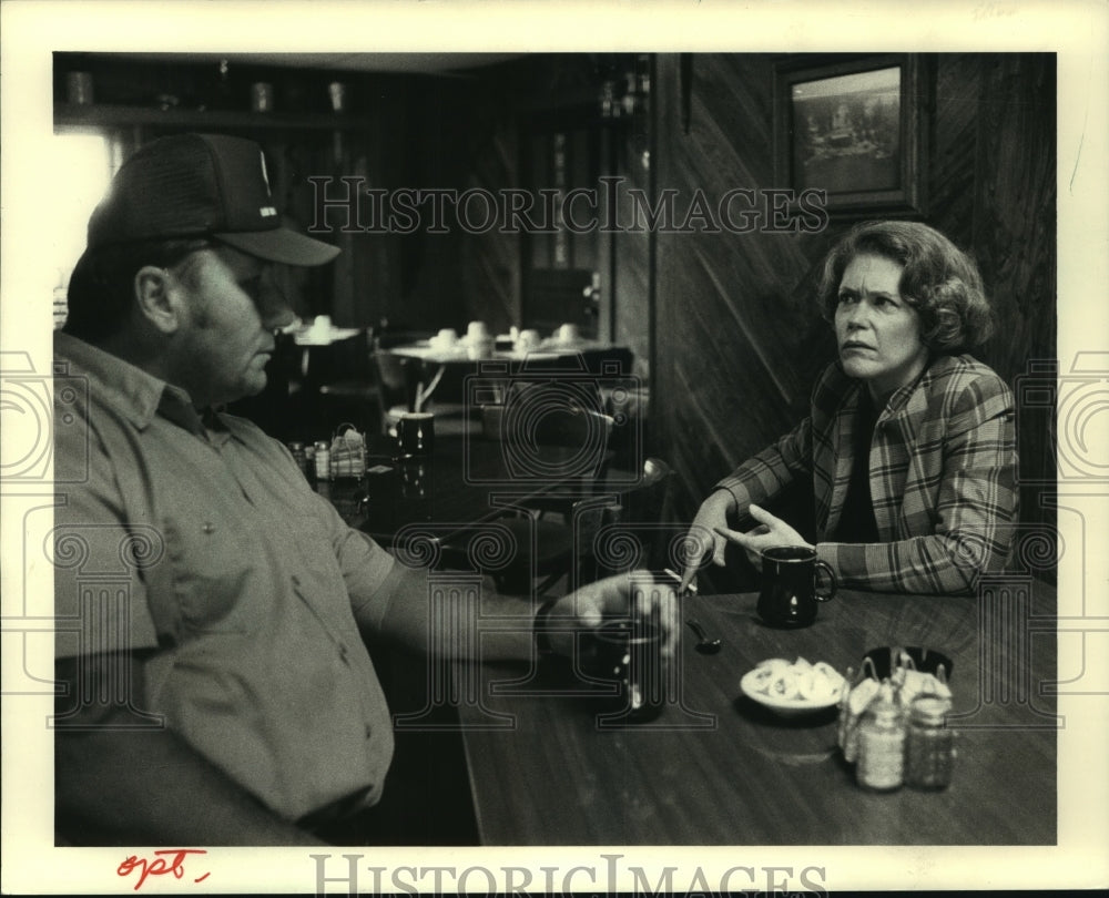1987, Kathryn Tierney talks with Flambeu tribal judge Tom Maulson - Historic Images