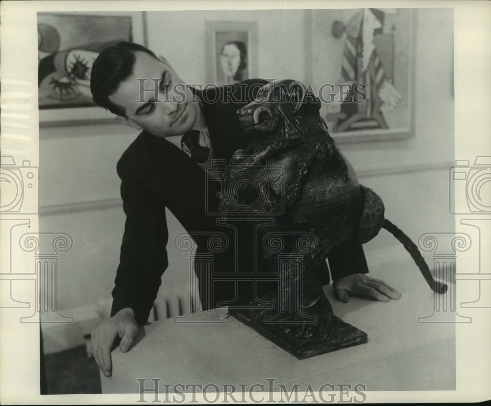 1956 Press Photo Visitor examines bronze she-monkey by Pablo Picasso - mjc22087 - Historic Images