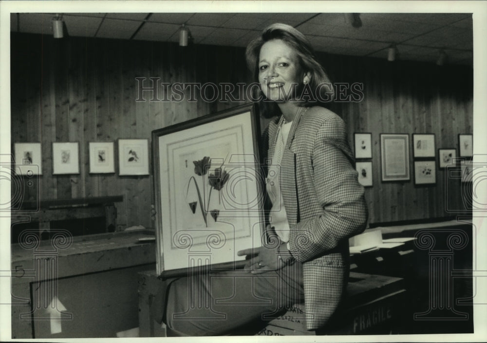 1990, Ruth Stiff holding watercolor at Milwaukee Public Museum - Historic Images
