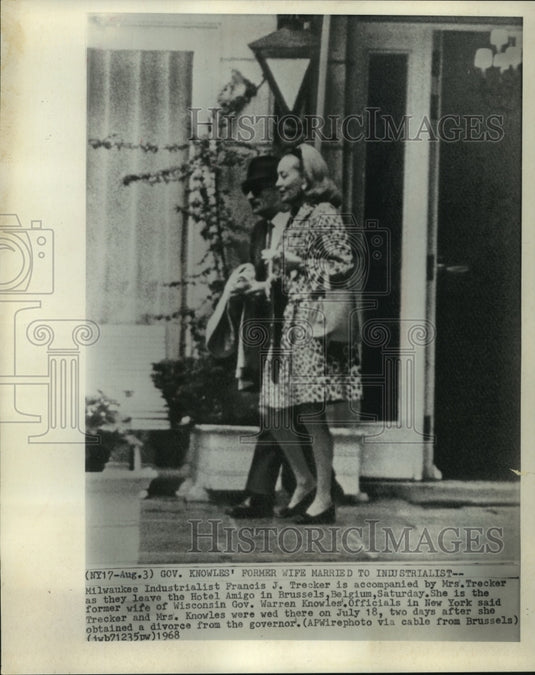1968, Francis J. Trecker & wife leaving hotel in Brussels, Belgium - Historic Images