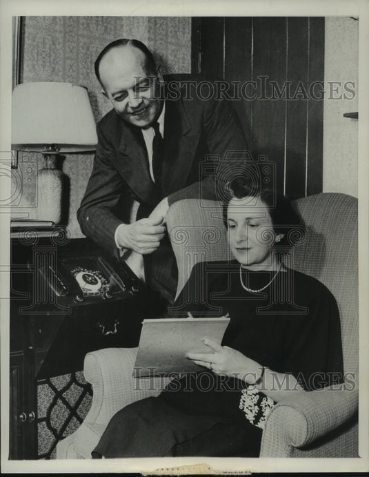 1948, Seated Woman Takes Notes Wile Man Looks Over Her Shoulder - Historic Images