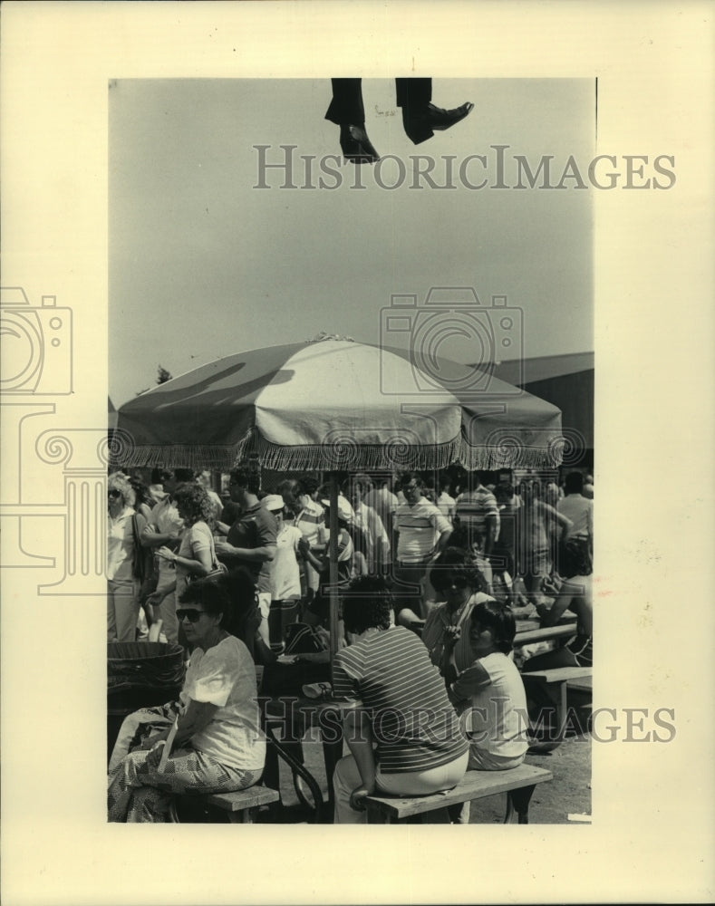 1983, A Sky Glider passenger heads upward above the Summerfest crowd - Historic Images