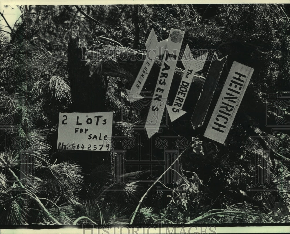 1985 Swamsauger Lake signs to were toppled by Wisconsin storm - Historic Images