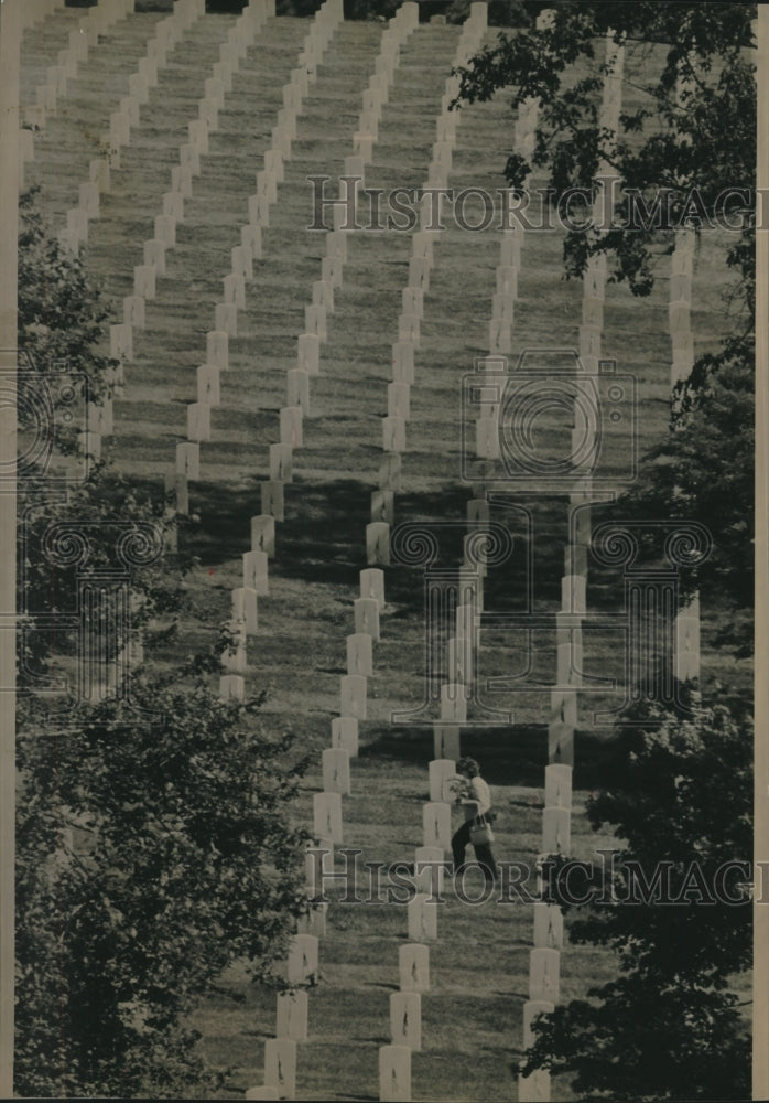 1991, Woman walks among Arlington National Cemetery - mjc23136 - Historic Images