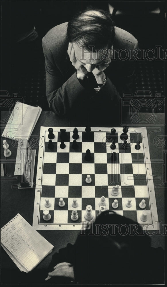 1986 Scott Kittsley studied the chess board at Milwaukee tournament - Historic Images