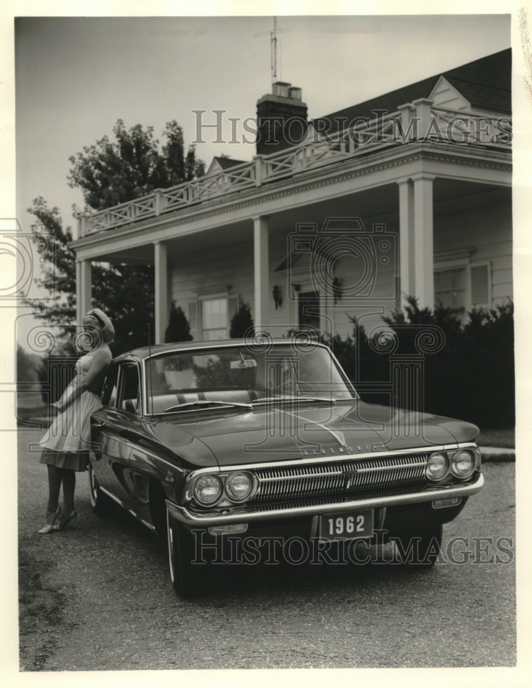 1963 Press Photo The fun-to-drive 1962 Cutlass Coupe shown with a pretty model. - Historic Images