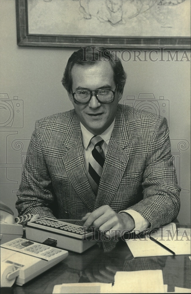 1984, Stockbroker, Spenser Thomas, in his office, Wisconsin - Historic Images