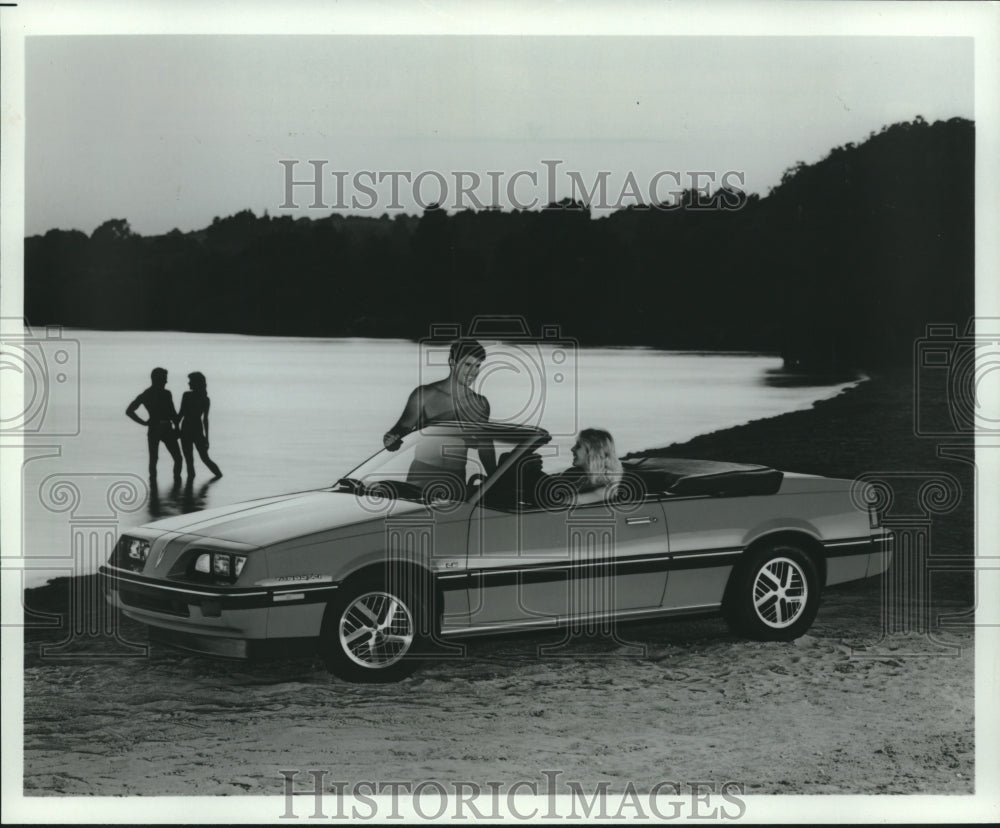 1984 Couples at lake, in Pontiac 2000 Sunbird Convertible - Historic Images