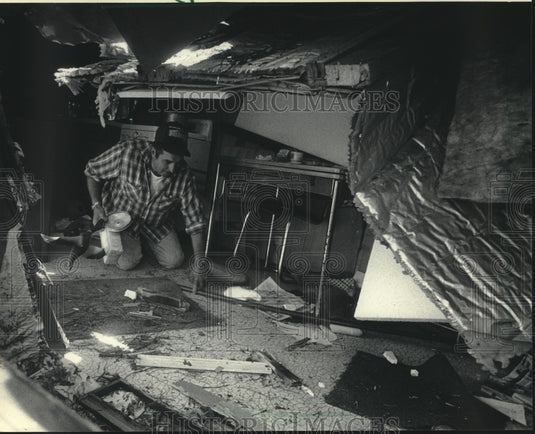 1985, Bob Nieuwenhuis searched for items at Cedar Falls Resort - Historic Images