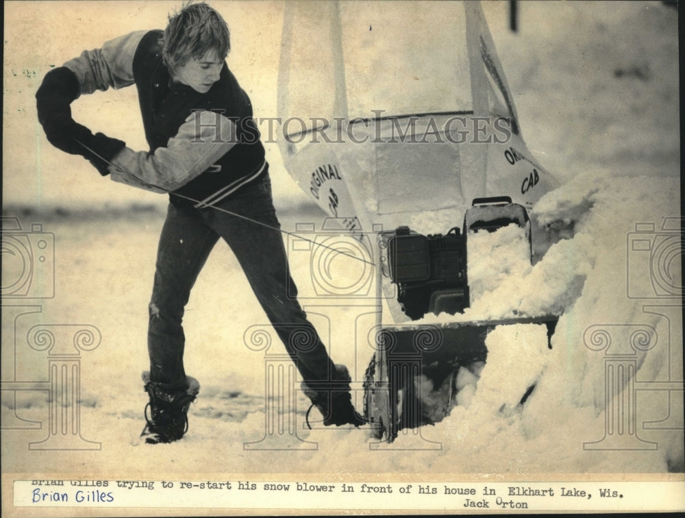 1985 Brian Gilles Stops To Restart His Snowblower in Elkhart - Historic Images