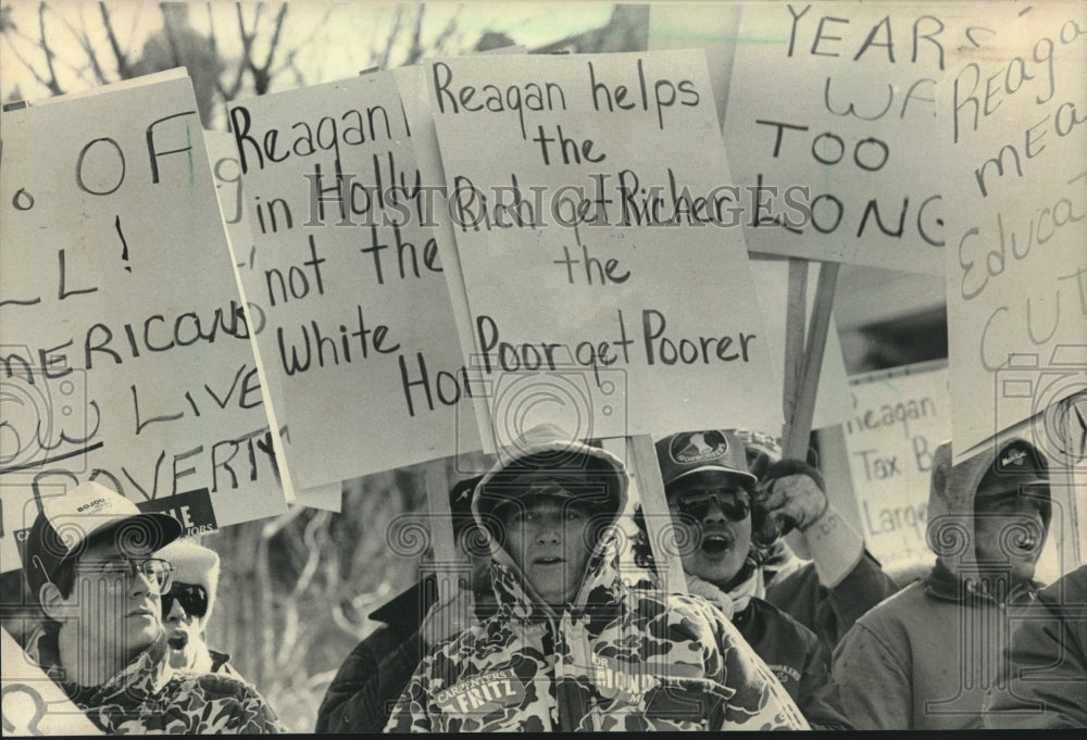 1984, Reagan protesters, with signs, parade route Dixon Illinois - Historic Images