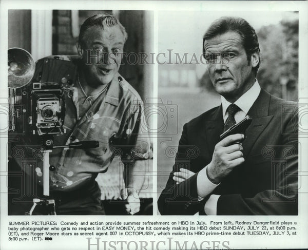 1987 Press Photo Actors Rodney Dangerfield & Roger Moore, HBO promotio ...