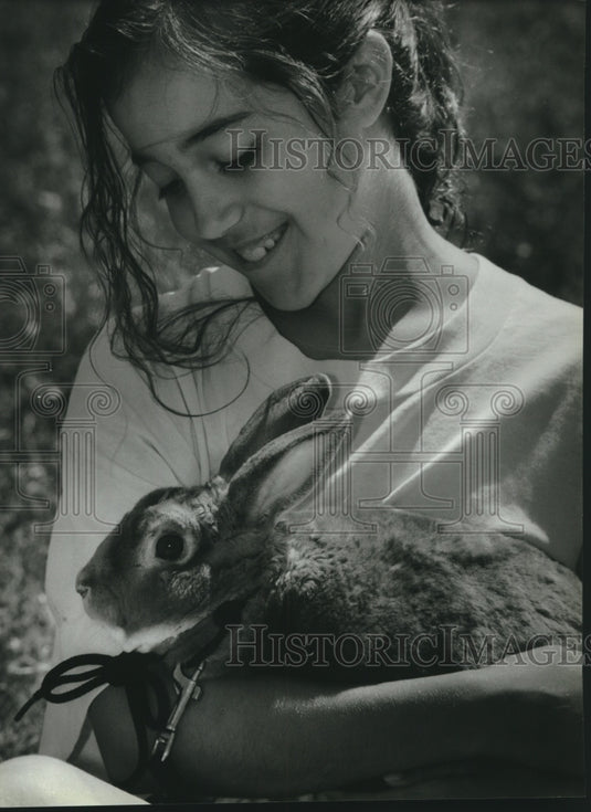 1993, Niky Metsa of Sussex, Wisconsin with her pet bunny, "Nibbles" - Historic Images
