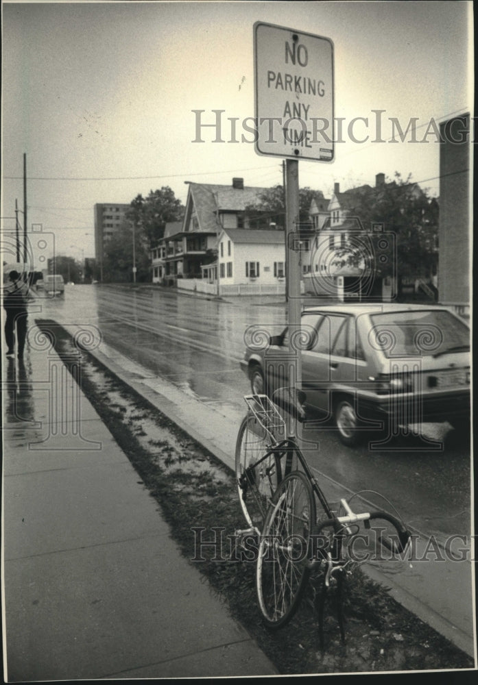 1985 Bicycle locked to street sign, University of Wisconsin-Madison - Historic Images