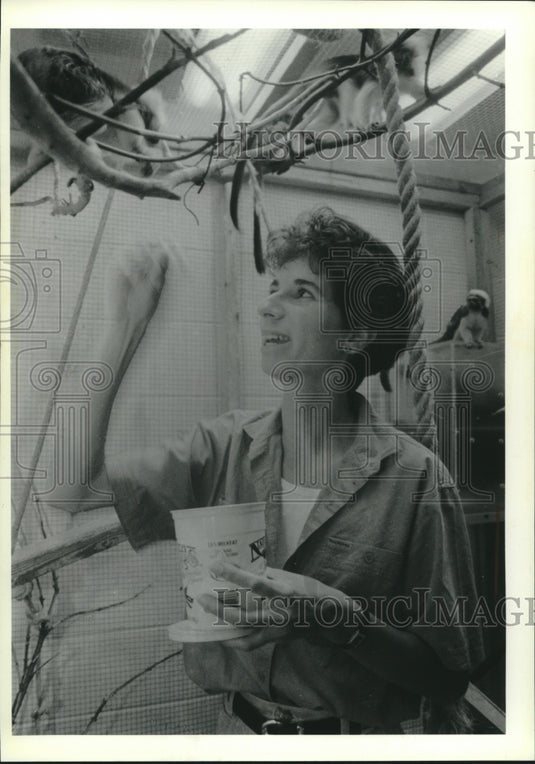 1990 Anne Savage feeds a monkey, University of Wisconsin-Madison - Historic Images