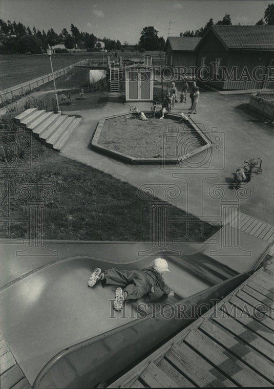 1985 Kids play Rinkeby day-care center near residences, Scandinavia. - Historic Images