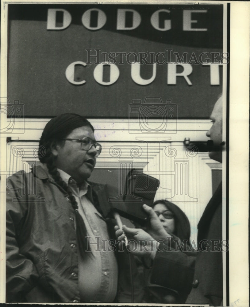1976, Michael E. Sturdevant talks to reporters at Dodge Courthouse - Historic Images