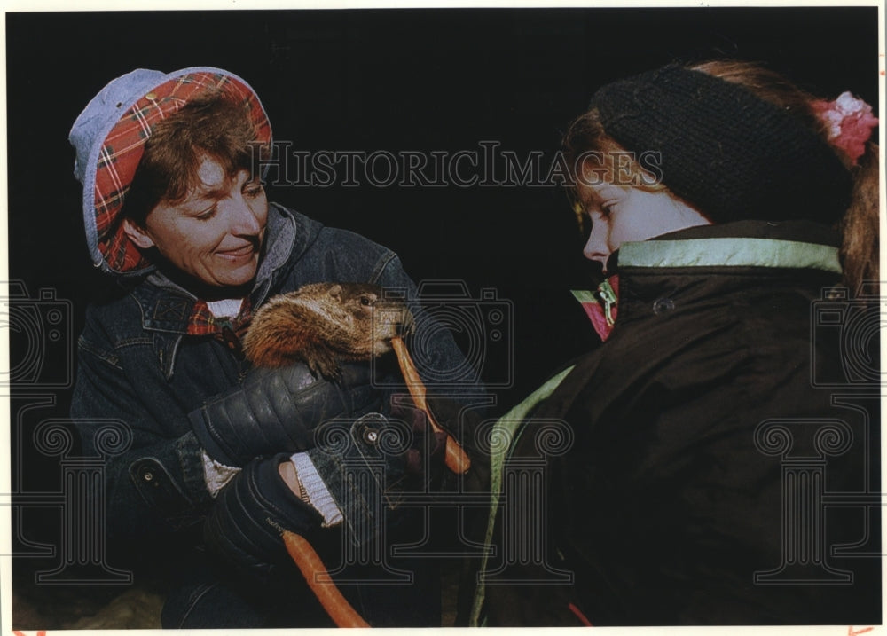 1984, Jimmy The Groundhog of Sun Prairie &amp; others feeding him carrots - Historic Images