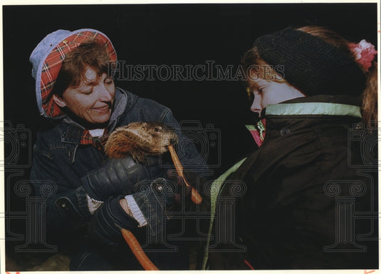 1984, Jimmy The Groundhog of Sun Prairie & others feeding him carrots - Historic Images
