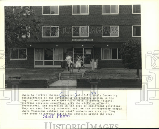 1987, Administrators leave hall at University of Wisconsin Superior - Historic Images