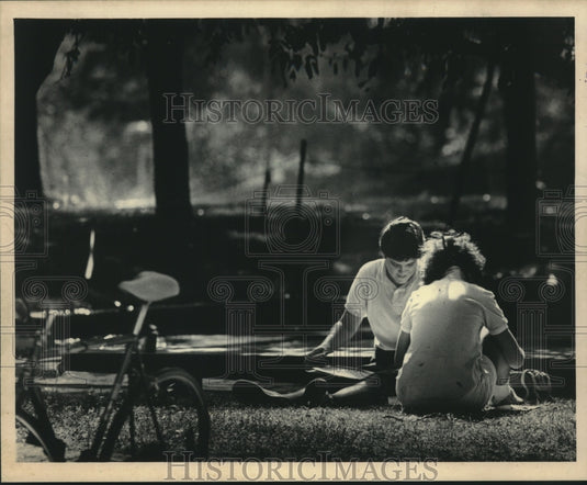 1983 UW-Madison students check registration materials near Ogg Hall - Historic Images