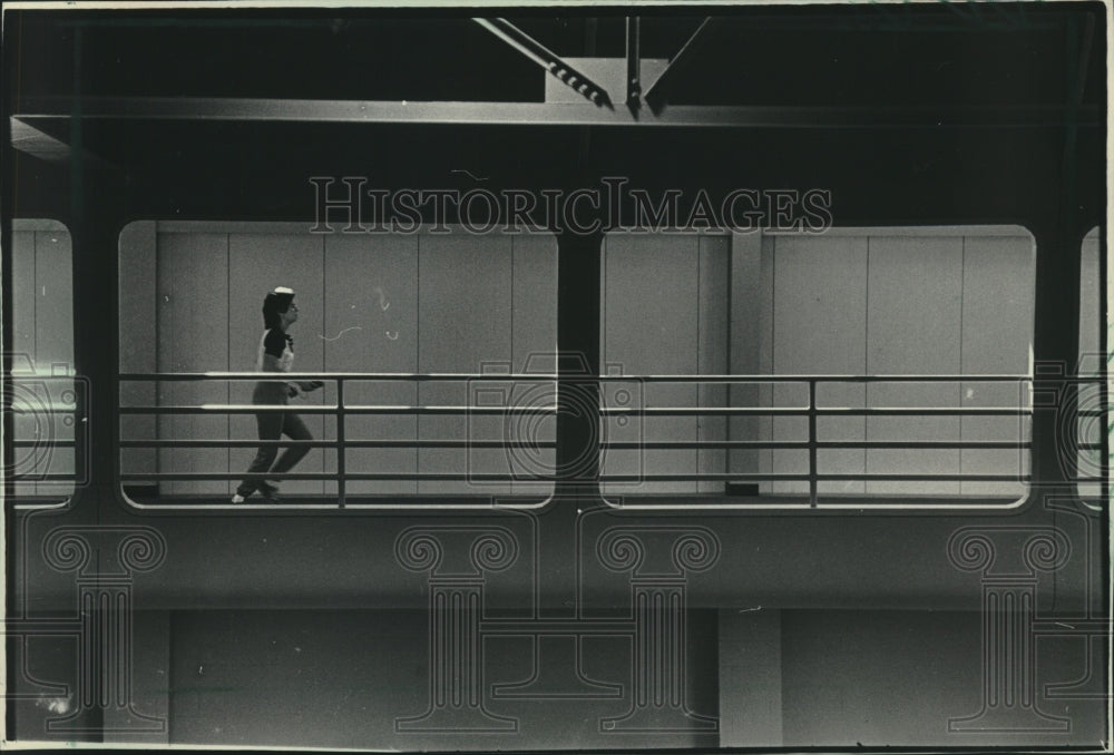 1984, A UW-Madison student jogs at Southeast Recreational Facility - Historic Images