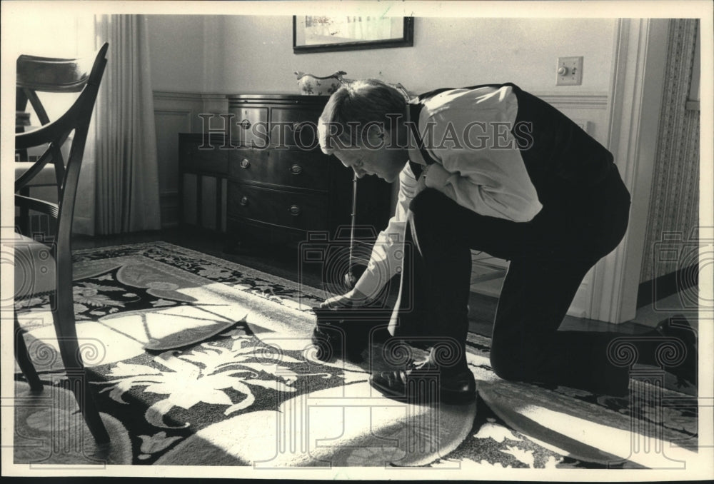 1987, University of Wisconsin System President Kenneth Shaw Pets Cat - Historic Images