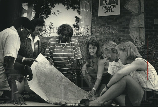 1991 Shawnee Sykes, others prepare trip to Potsdam, United States. - Historic Images