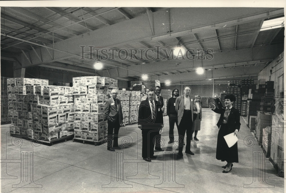 1988, Gwen McLean gives tour of Second Harvesters of WI warehouse - Historic Images