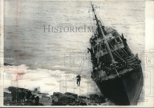 1932 Crewman from French trawler transferred to safety off Cornwall - Historic Images