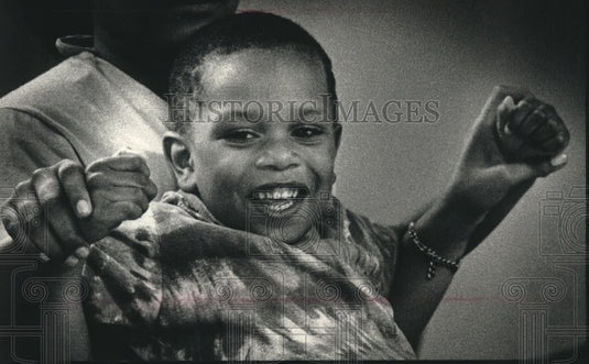1989, Little Tiffany Garrett at the Shade Tree Women & Family Center - Historic Images
