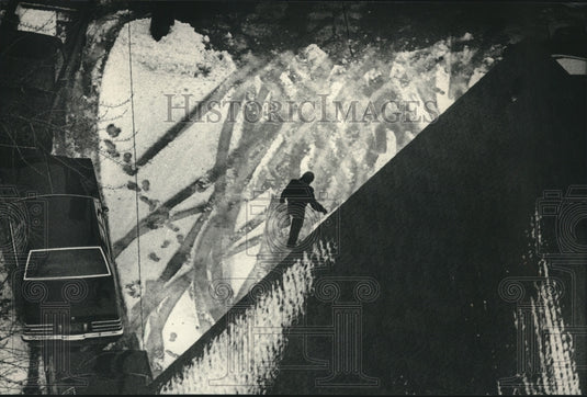 1988 Man salting driveway on South 2nd Street, Milwaukee, WI - Historic Images