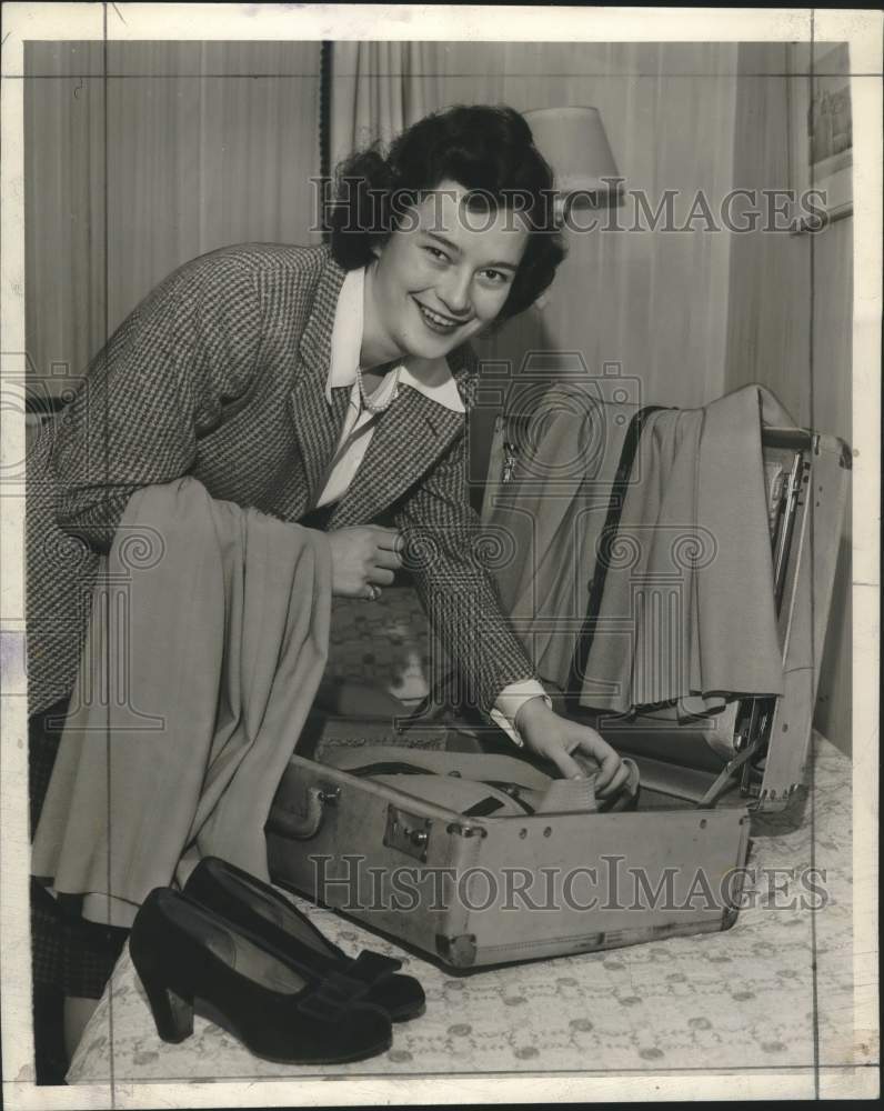 1942, Mary Hall packing for a trip to California, Wauwatosa - Historic Images