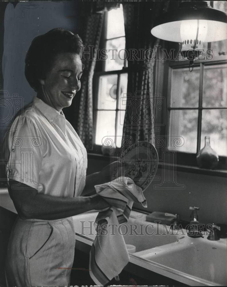 1960, Woman washing dishes - mjc26460 - Historic Images