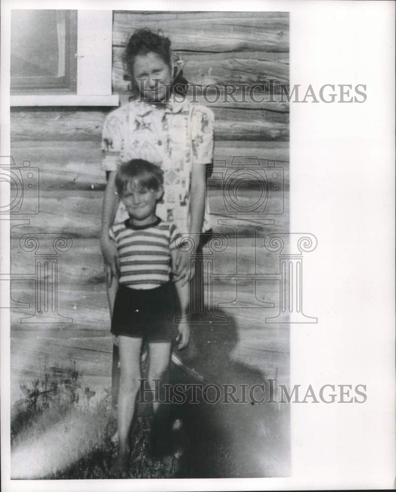 1956, Ruth posed for a picture with a young member of the party. - Historic Images
