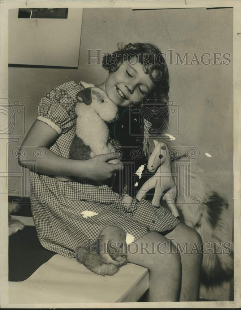1938, Peggy Reeve with her collection of stuffed dogs - mjc26697 - Historic Images