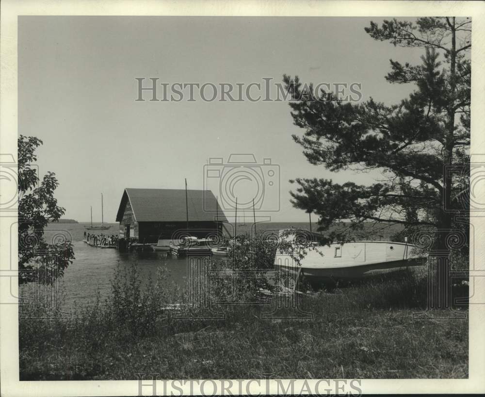 Press Photo Unknown Location: Boat Dock and a Boat Partially Out of Water - Historic Images
