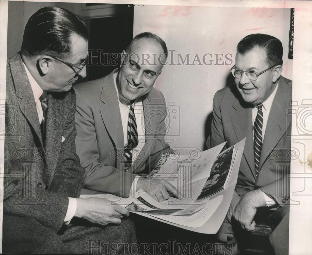 1956 Press Photo Wagner, Pollock and other discuss plans in a folder - mjc27110 - Historic Images