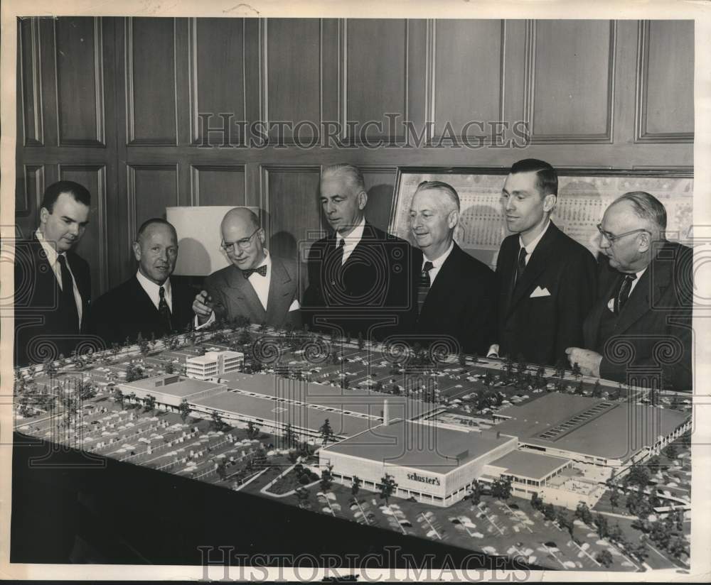 1954, Thomas A. Friedmann and others looking over Capital Court Model - Historic Images