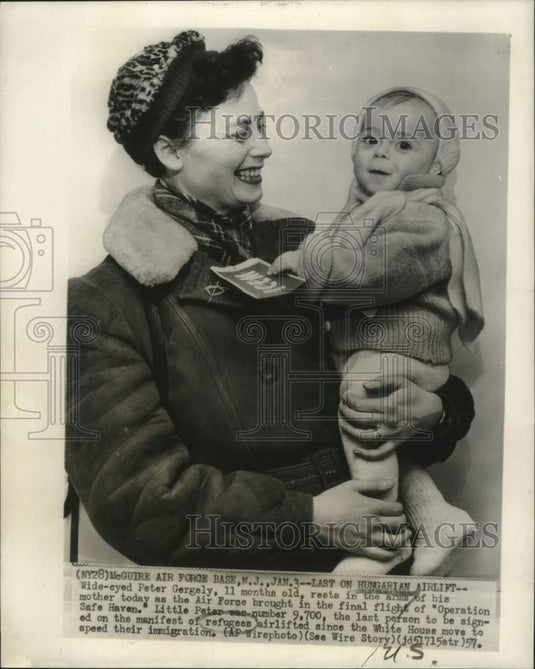 1957, Peter Gergely in his mother's arms, refugees from Hungaria - Historic Images